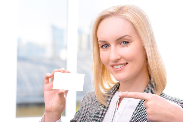 Nice businesswoman holding card - Foto, immagini