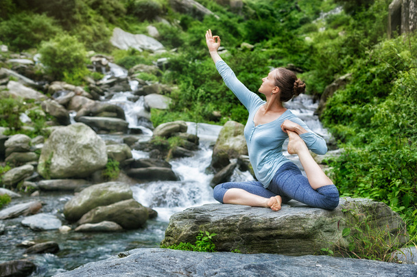 Sorty fit woman doing yoga asana outdoors - Photo, Image