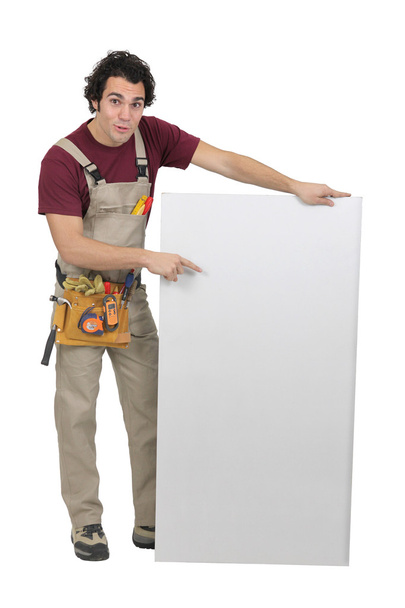 Carpenter pointing to a blank board - Fotó, kép