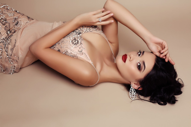 gorgeous young woman with dark hair in luxurious dress  - Zdjęcie, obraz