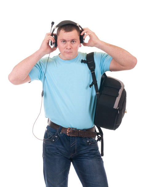νεαρός φοιτητής να ακούτε μουσική στο ακουστικό - Φωτογραφία, εικόνα