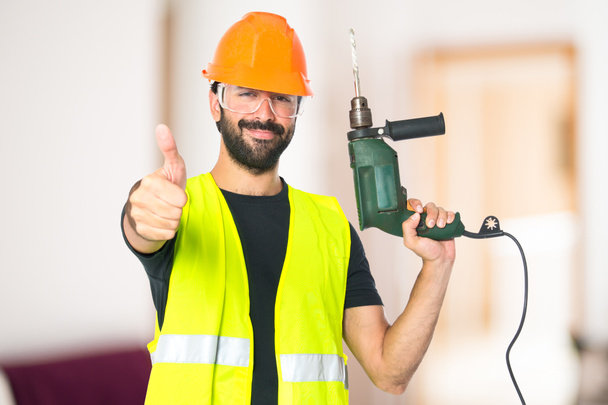 workman with drill over white background - Photo, Image