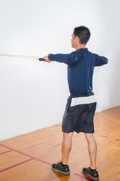Resistance band exercise for shoulder strength - Photo, Image