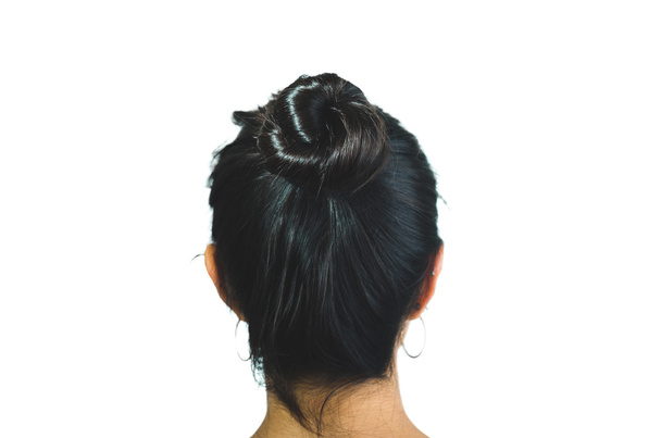 Rear view of brunette girl with hair bun - Φωτογραφία, εικόνα