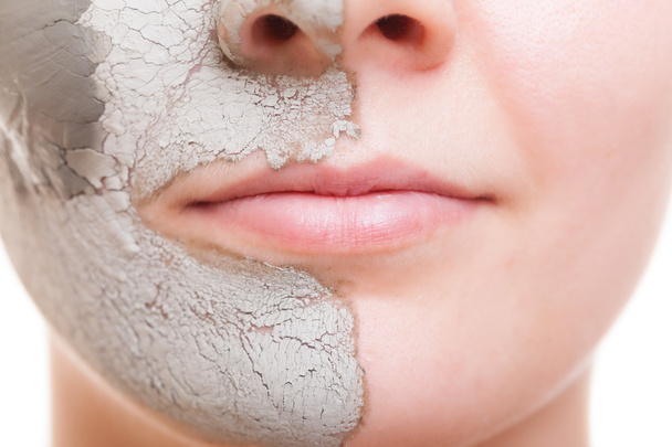 Skin care. Woman applying clay mask on face. Spa. - Foto, afbeelding