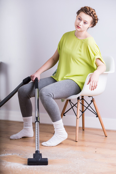 Exhausted housewife with vacuum - Fotoğraf, Görsel