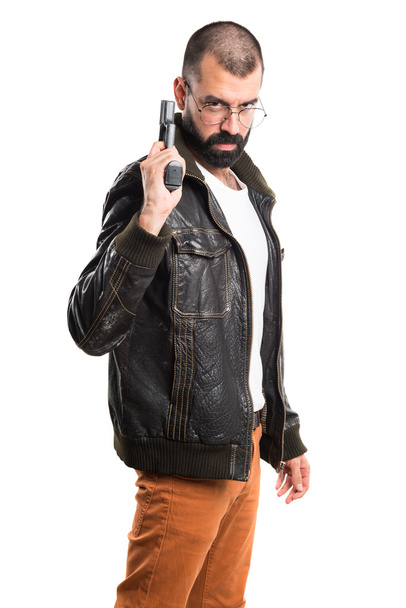 Chulo sosteniendo una pistola
 - Foto, Imagen
