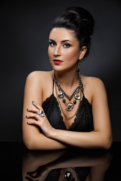 Girl with necklace and bracelets - 写真・画像