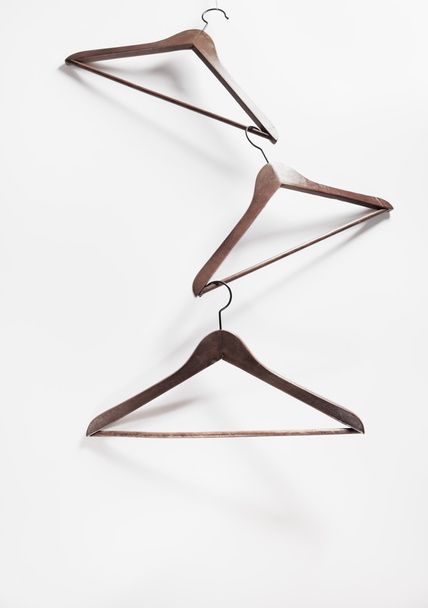 Image of empty hangers on white background - Foto, afbeelding