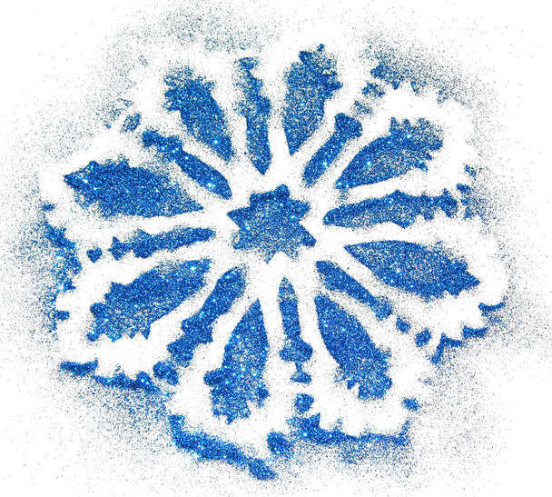 Blurred background with snowflake of blue glitter sparkles on white - Photo, Image