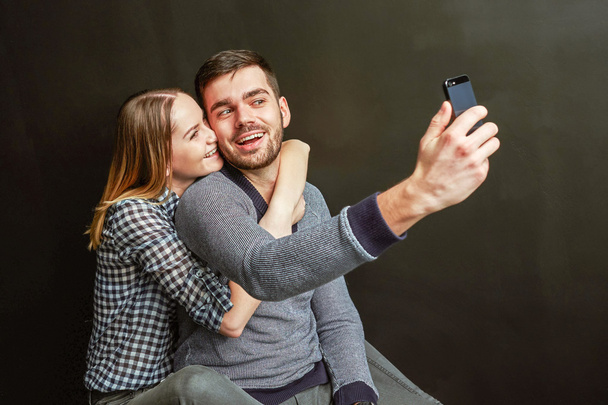 Couple making a funny selfie - Фото, изображение