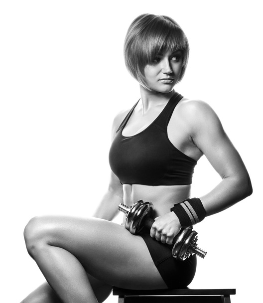 Portrait of redhead woman sitting and holding straps and workout - Photo, image