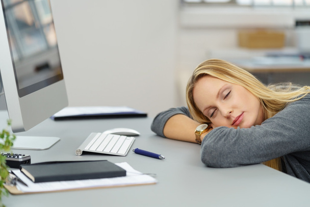 Tired Office Woman Leaning on her Desk - Valokuva, kuva