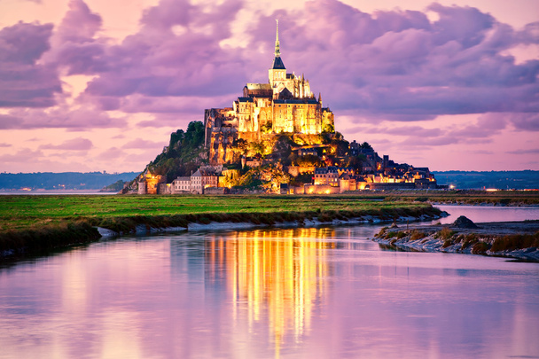Mont Saint-Michel reflecting in water on sunset, Normandy, France - Photo, Image