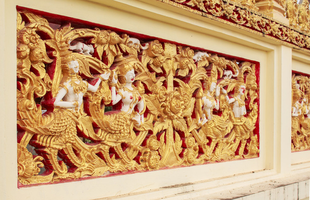 Sculpture thaïlandaise sur le mur du temple
 - Photo, image