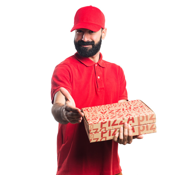 Pizza delivery man making a deal - Foto, afbeelding