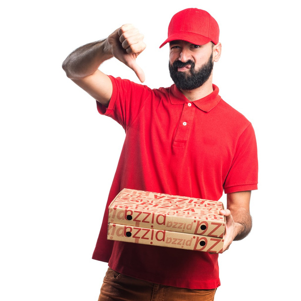 Pizza delivery man doing bad signal - 写真・画像