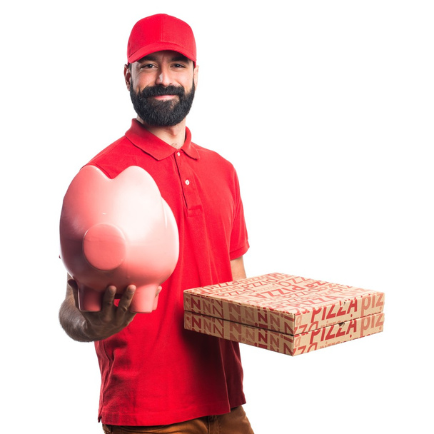 Чоловік доставки піци тримає скарбничку
 - Фото, зображення