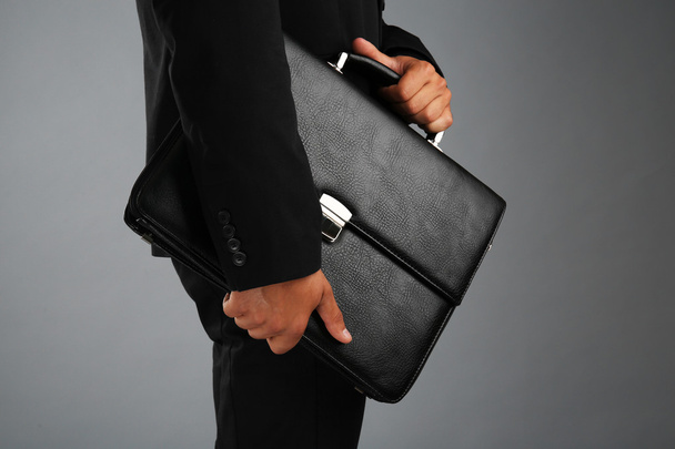 Elegant man in suit with briefcase - Foto, imagen