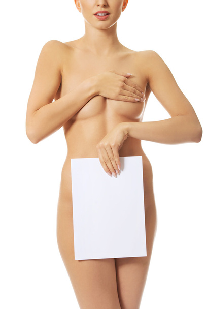 Young naked woman holding blank banner. - Φωτογραφία, εικόνα