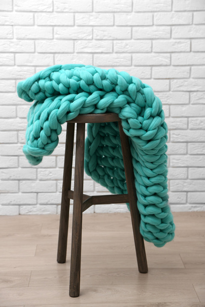 Knitted woolen blanket on chair - Valokuva, kuva