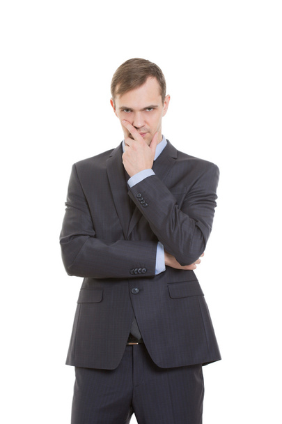 gestures distrust lies. body language. man in business suit isolated on white background. closed position. closes mouth by hand. his arms - Photo, Image