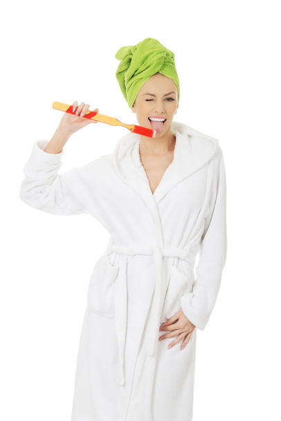 Beautiful woman with oversized toothbrush. - Zdjęcie, obraz