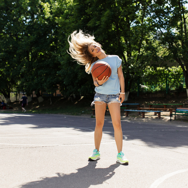 Sexy girl on the basketball court - Photo, image