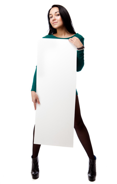 Beautiful sexy woman holding empty white board. - Zdjęcie, obraz