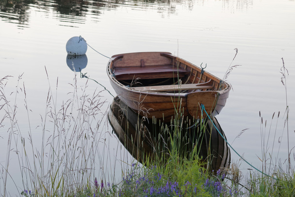 Rowboat in calm water in the harbour - Photo, Image