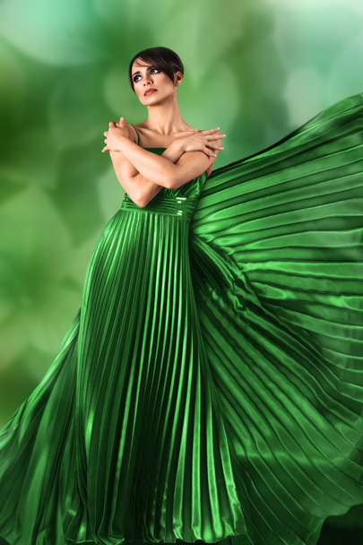 Woman in long dress over nature background - Photo, image