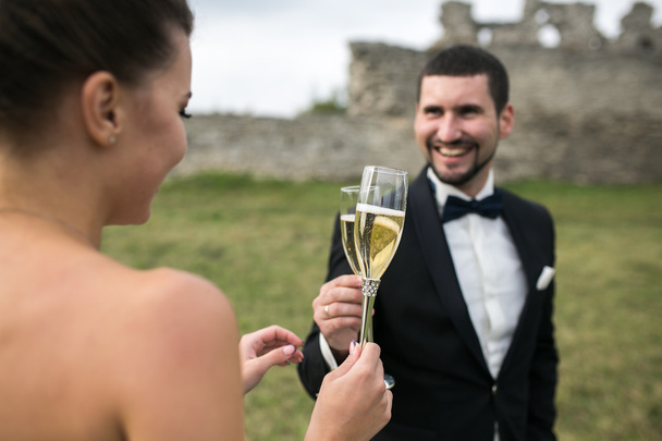 bridal couple clink glasses of champagne - 写真・画像