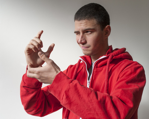 Portret młodego mężczyzny w czerwonej kurtce - Zdjęcie, obraz