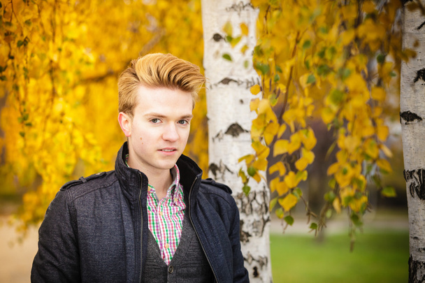 Young handsome man outdoors - 写真・画像