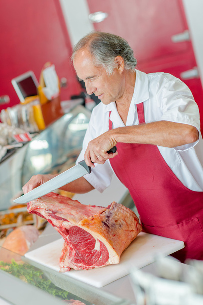 Butcher preparing chops and apron - Fotoğraf, Görsel