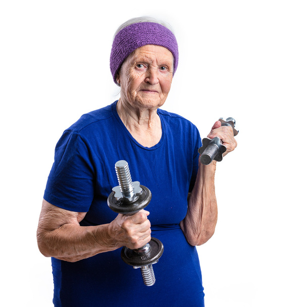 Senior vrouw met halters - Foto, afbeelding