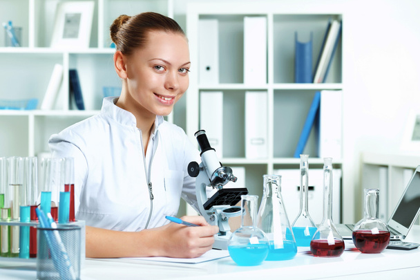 Young scientist working in laboratory - Fotó, kép