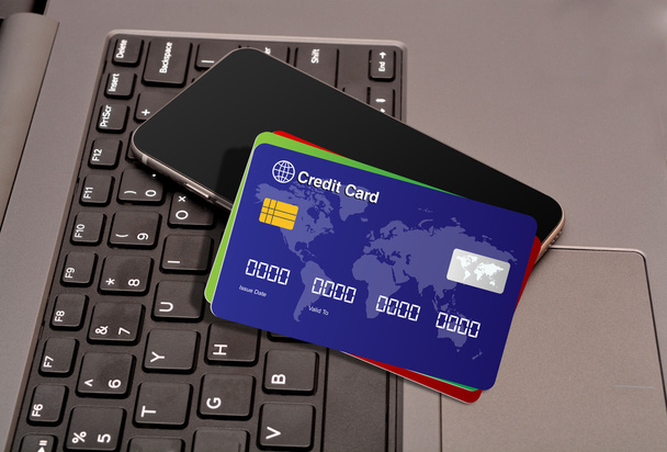 Tarjetas de crédito y smartphone con teclas de teclado
 - Foto, imagen