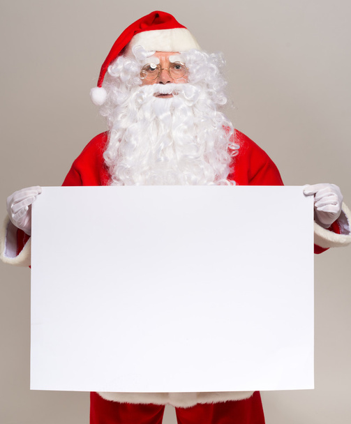 Santa Claus holding sign - Valokuva, kuva