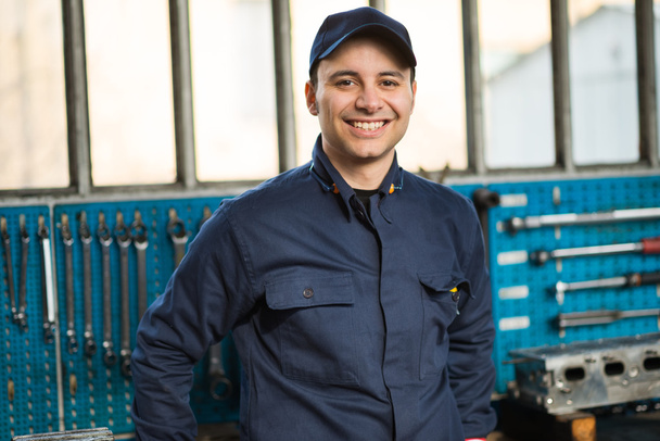 smiling young mechanic - Фото, изображение