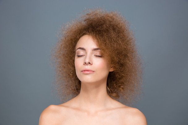 Beauty portrait of curly relaxed young woman with eyes closed - Photo, Image