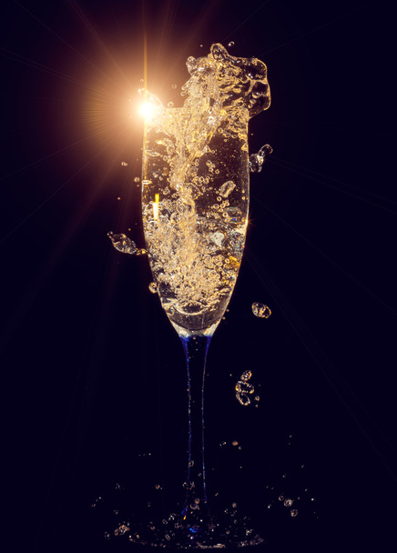 Glass of champagne with splashes - Fotó, kép