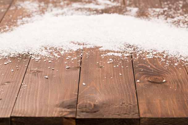 Christmas snow on wooden background - Foto, imagen