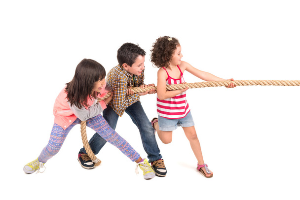 Children group pulling rope - Foto, immagini