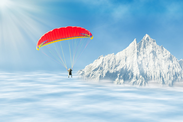 Freestyle solo parapente sobre las nubes contra el pico de la montaña
  - Foto, imagen