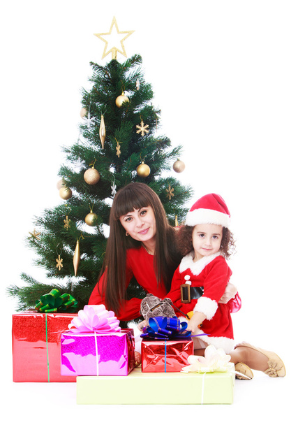 Mom and daughter at Christmas tree - Photo, image