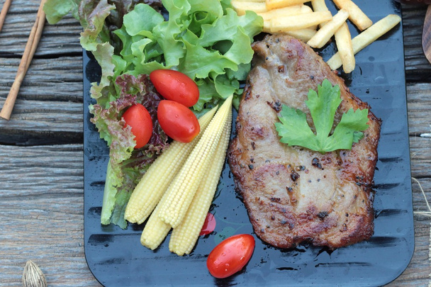 Pork steak of delicious with vegetable and tomato. - Photo, Image
