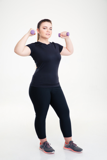Fat woman workout with dumbbells - Fotó, kép