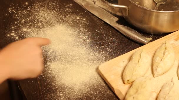 draws a smiley on the flour on table for baking - Footage, Video
