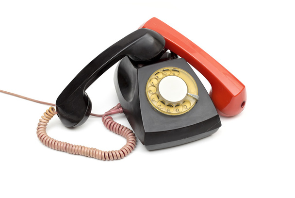 oude telefoon op de witte achtergrond - Foto, afbeelding